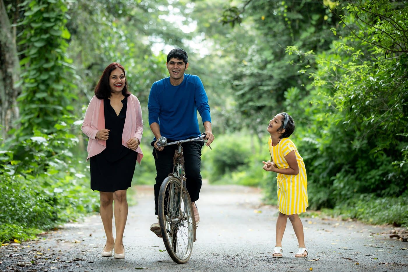 India family walking bike